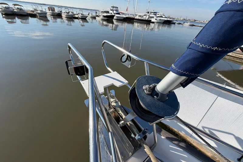 Nae Hassle Yacht Photos Pics Bow of 2004 Beneteau 57 yacht docked at marina with calm waters.