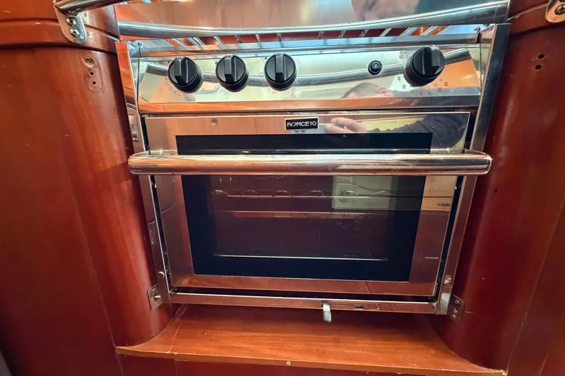 Nae Hassle Yacht Photos Pics Stainless steel oven in 2004 Beneteau 57 yacht kitchen.