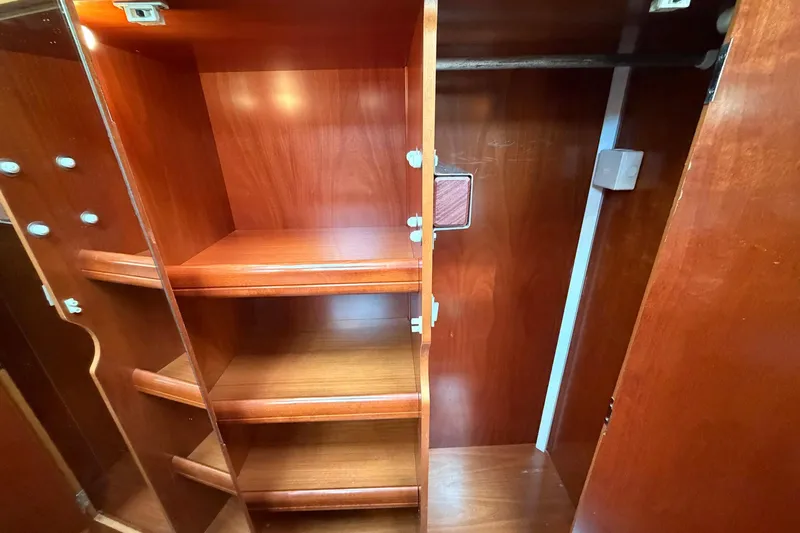 Nae Hassle Yacht Photos Pics Wooden interior shelving and closet space on a 2004 Beneteau 57 yacht.