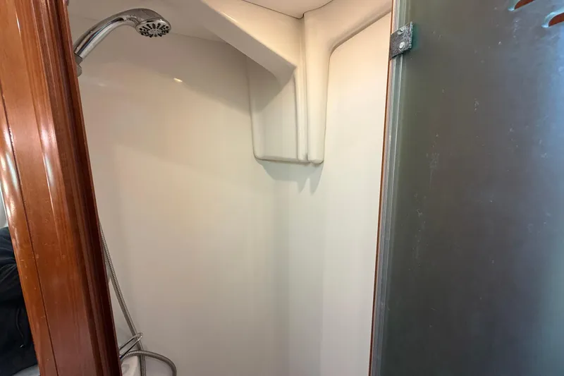 Nae Hassle Yacht Photos Pics Shower area inside a 2004 Beneteau 57 yacht, featuring a sleek design.