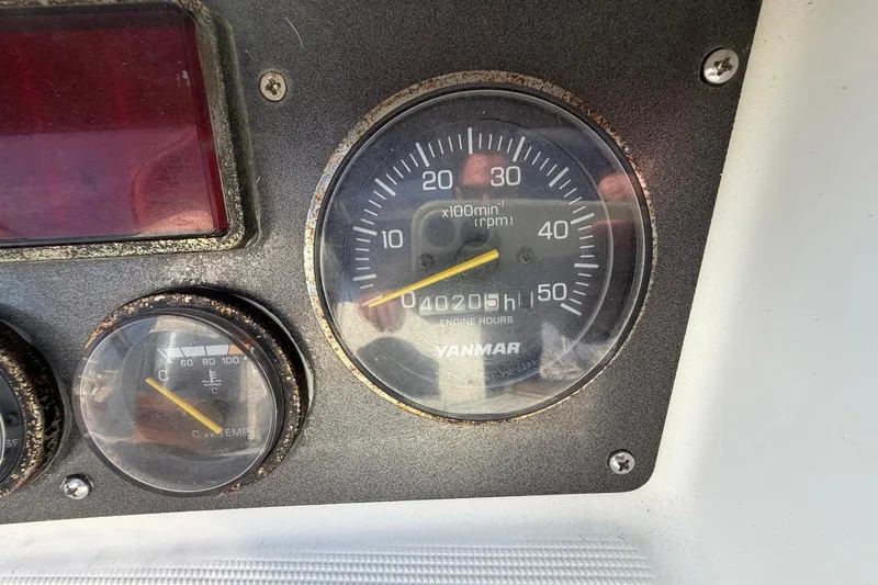 Nae Hassle Yacht Photos Pics Close-up of Beneteau 57 2004 engine gauges, showing RPM and engine hours.