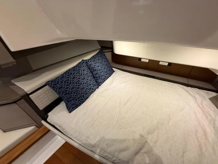  Yacht Photos Pics 2023 Tiara Yachts 43 LS cabin interior with bed and decorative pillows.