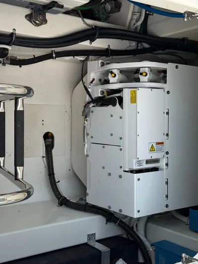  Yacht Photos Pics Engine compartment of 2023 Tiara Yachts 43 LS, showcasing mechanical components and wiring.