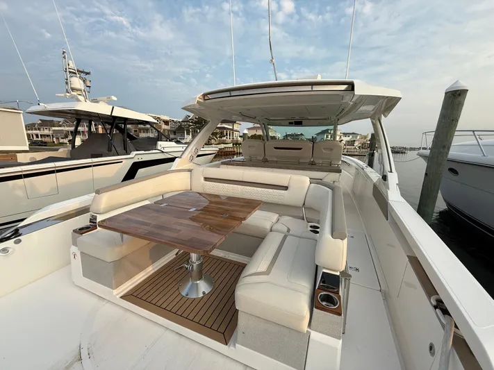  Yacht Photos Pics 2023 Tiara Yachts 43 LS luxury boat with spacious seating and elegant design.