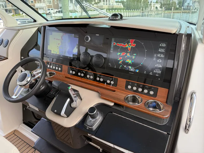  Yacht Photos Pics 2023 Tiara Yachts 43 LS helm with advanced navigation displays and controls.