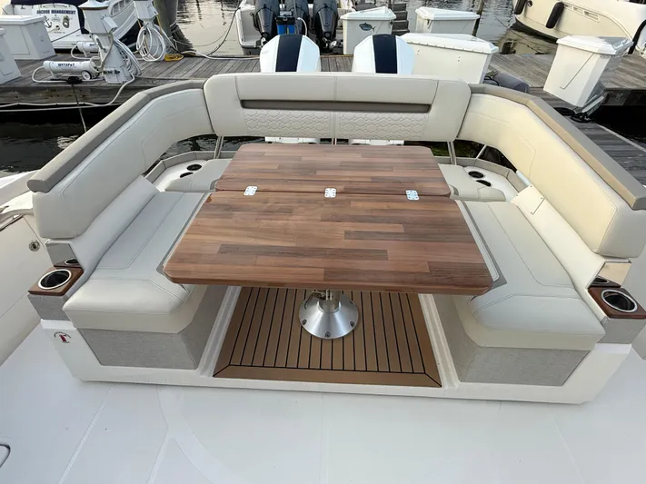  Yacht Photos Pics 2023 Tiara Yachts 43 LS boat with elegant seating and wooden table.
