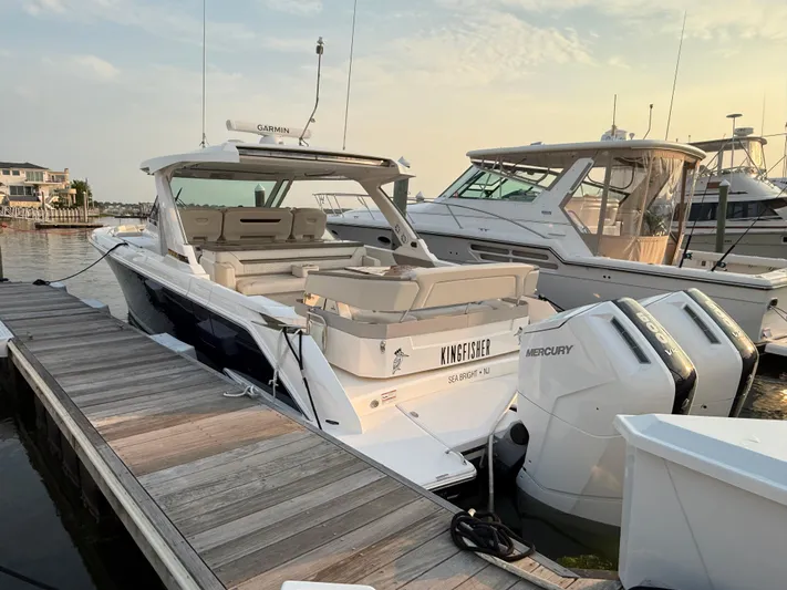  Yacht Photos Pics 2023 Tiara Yachts 43 LS docked, featuring twin Mercury outboard engines.