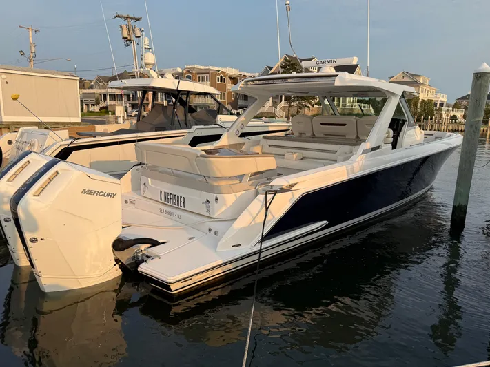  Yacht Photos Pics 2023 Tiara Yachts 43 LS docked, featuring sleek design and powerful Mercury engines.