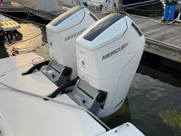  Yacht Photos Pics Twin Mercury outboard engines on a 2023 Tiara Yachts 43 LS at a marina.