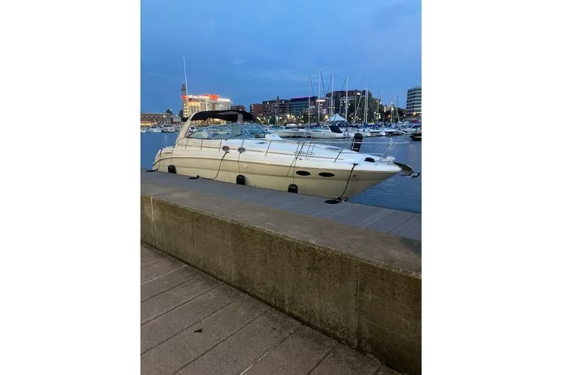 Lyman Zerga Yacht Photos Pics 2001 Sea Ray 380 Sundancer yacht docked at a marina during twilight.