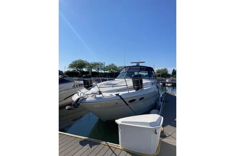 Lyman Zerga Yacht Photos Pics 2001 Sea Ray 380 Sundancer yacht docked under clear blue sky.