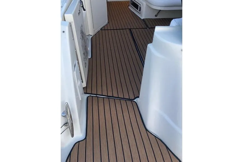 Lyman Zerga Yacht Photos Pics 2001 Sea Ray 380 Sundancer boat deck with wood-like flooring.