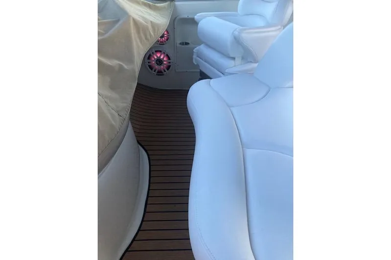 Lyman Zerga Yacht Photos Pics Interior of 2001 Sea Ray 380 Sundancer with white seating and wood flooring.