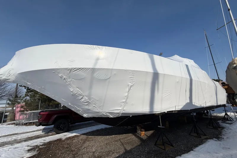 Lyman Zerga Yacht Photos Pics 2001 Sea Ray 380 Sundancer boat covered in white tarp for winter storage.