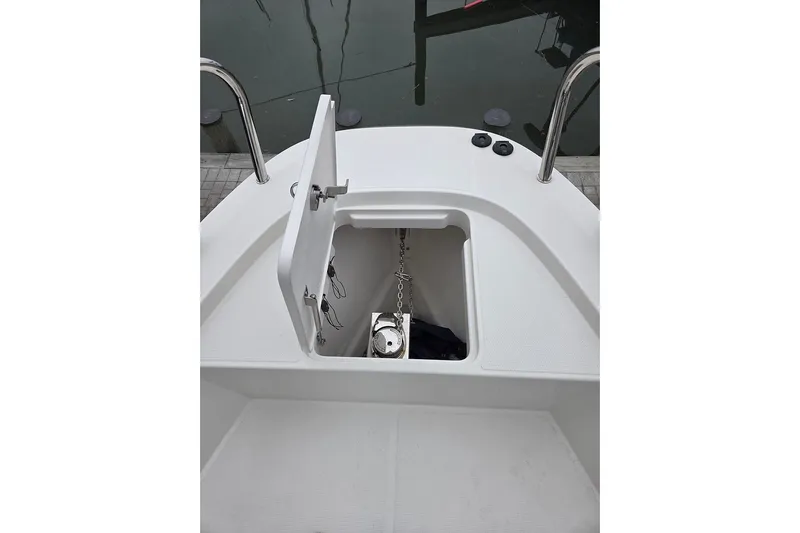 Ann #121 Yacht Photos Pics Open anchor compartment on 2023 Nimbus T9 boat, showing chain and anchor storage.