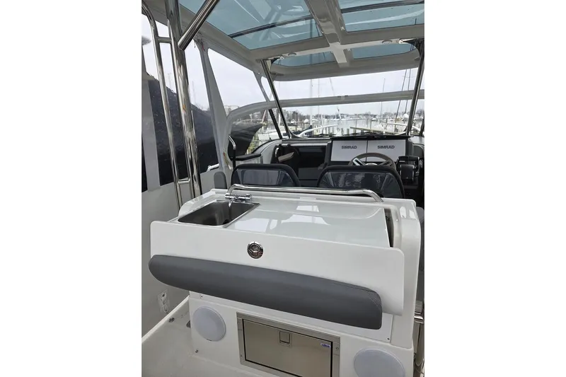 Ann #121 Yacht Photos Pics 2023 Nimbus T9 boat interior with modern dashboard and seating.