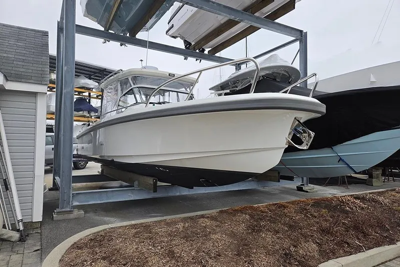Ann #121 Yacht Photos Pics 2023 Nimbus T9 boat in storage, elevated on a metal rack.