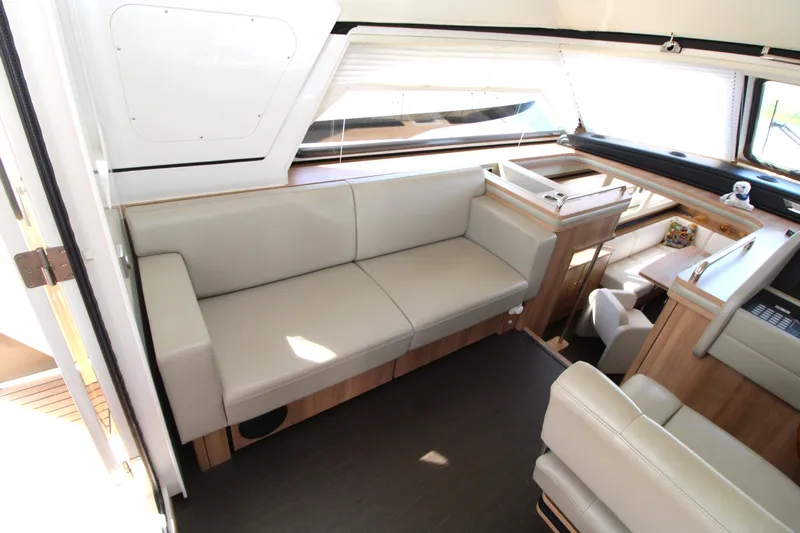  Yacht Photos Pics Luxurious interior of 2024 Linssen 55 SL AC Variotop yacht with beige seating and wooden accents.