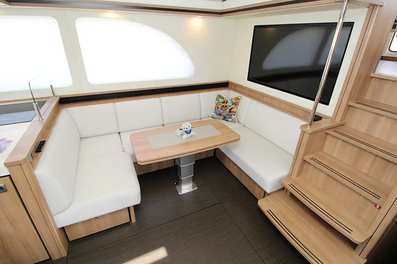  Yacht Photos Pics Luxurious interior of 2024 Linssen 55 SL AC Variotop yacht with modern seating and table.