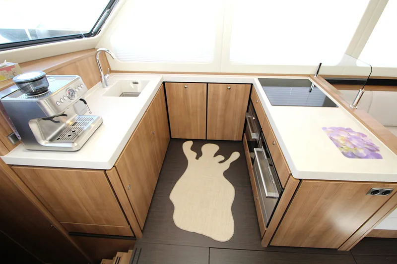  Yacht Photos Pics Modern kitchen in 2024 Linssen 55 SL AC Variotop yacht with coffee machine and stove.
