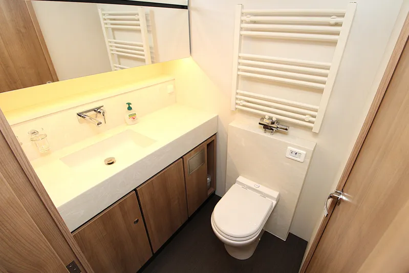  Yacht Photos Pics Modern bathroom in 2024 Linssen 55 SL AC Variotop yacht, featuring sleek fixtures and wooden cabinetry.