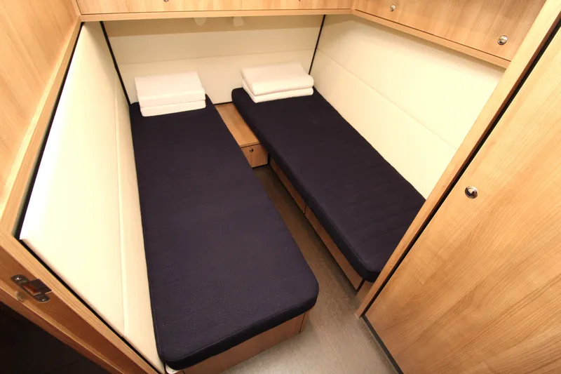  Yacht Photos Pics 2024 Linssen 55 SL AC Variotop cabin with twin beds and wooden interior.