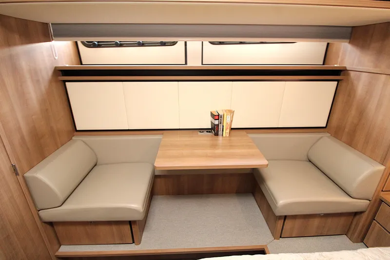  Yacht Photos Pics Interior of 2024 Linssen 55 SL AC Variotop yacht with cozy seating and table.