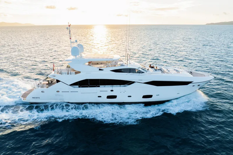 2015 Sunseeker 115' Sport Yacht Yacht Photos Pics 2015 Sunseeker 115 Sport Yacht cruising at sunset on open sea.