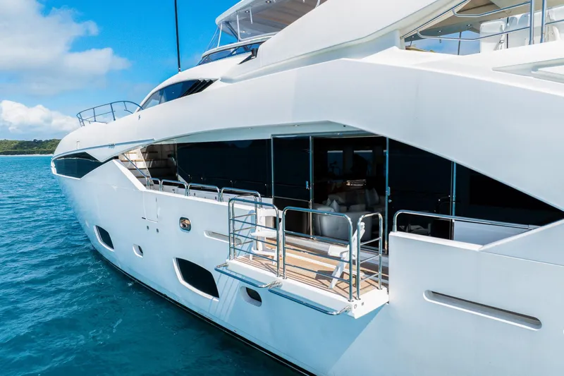 2015 Sunseeker 115' Sport Yacht Yacht Photos Pics 2015 Sunseeker 115 Sport Yacht on blue ocean, showcasing sleek design and luxury features.