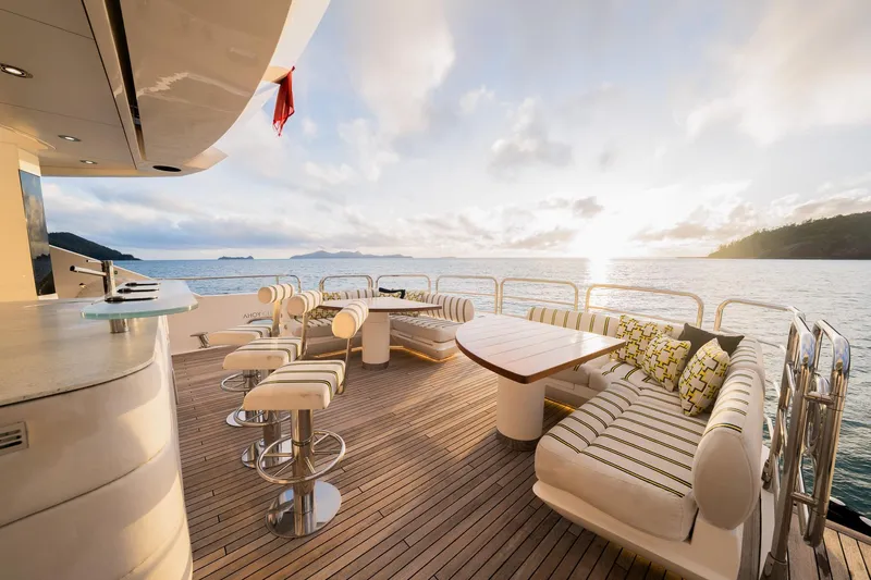 2015 Sunseeker 115' Sport Yacht Yacht Photos Pics Luxurious Sunseeker 115 Sport Yacht 2015 deck with elegant seating and ocean view at sunset.