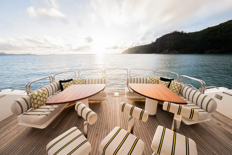 2015 Sunseeker 115' Sport Yacht Yacht Photos Pics Luxurious Sunseeker 115 Sport Yacht deck with stylish seating, overlooking serene ocean view.