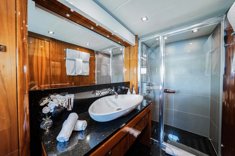 2015 Sunseeker 115' Sport Yacht Yacht Photos Pics Luxurious bathroom on 2015 Sunseeker 115 Sport Yacht with elegant wood and modern fixtures.