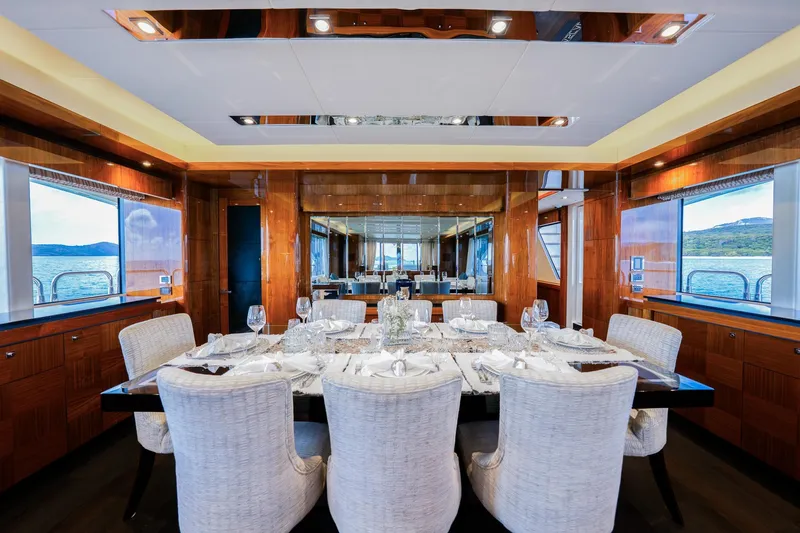 2015 Sunseeker 115' Sport Yacht Yacht Photos Pics Luxurious dining area on 2015 Sunseeker 115 Sport Yacht with elegant table setting and ocean views.