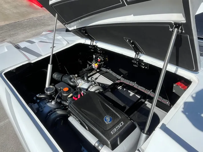  Yacht Photos Pics Open engine compartment of 2018 MTI 52RP boat, showcasing powerful engine components.