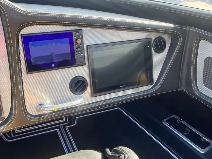  Yacht Photos Pics Dashboard of 2018 MTI 52RP boat with dual screens and sleek design.