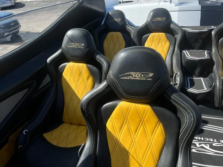  Yacht Photos Pics Luxurious MTI 52RP 2018 boat seats with black and yellow diamond stitching.