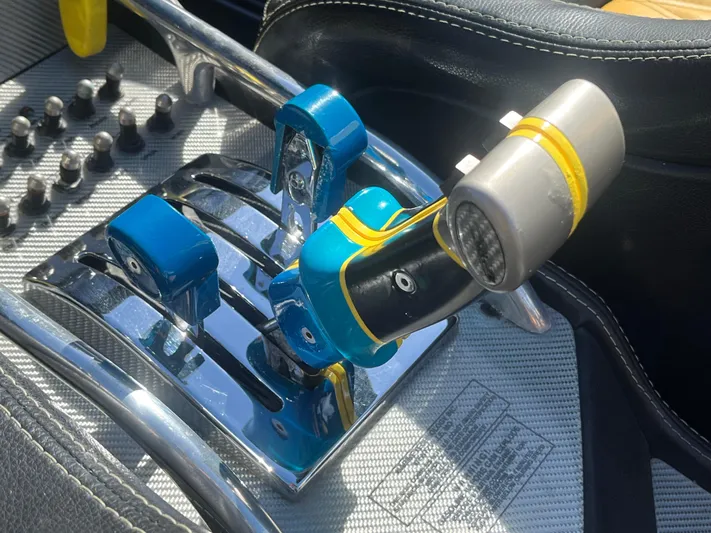  Yacht Photos Pics Close-up of MTI 52RP 2018 boat throttle controls with blue and chrome accents.