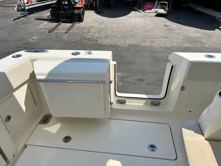  Yacht Photos Pics 2025 Scout 357 LXF boat deck with seating and storage compartments.