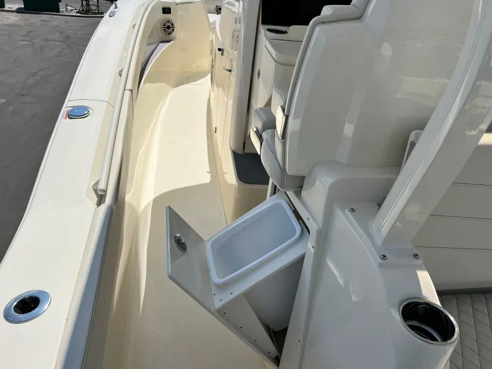  Yacht Photos Pics 2025 Scout 357 LXF boat interior with storage compartment and seating area.