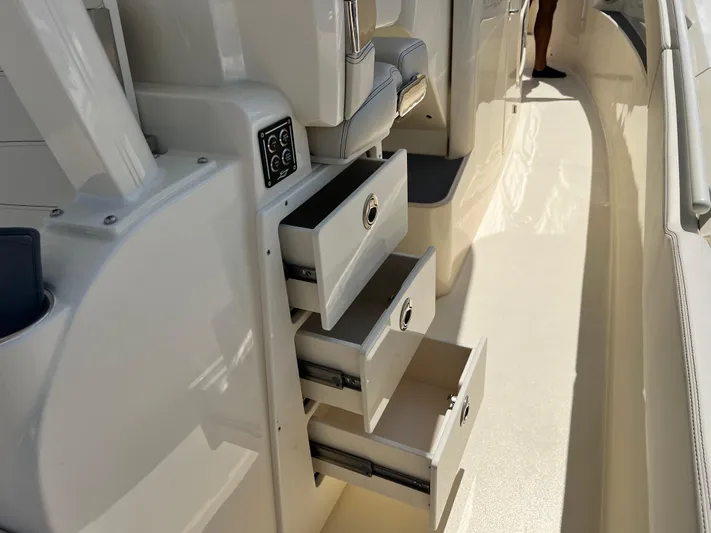  Yacht Photos Pics 2025 Scout 357 LXF boat interior with open storage drawers.