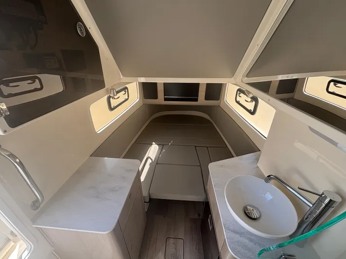  Yacht Photos Pics 2025 Scout 357 LXF cabin interior with modern design and compact amenities.