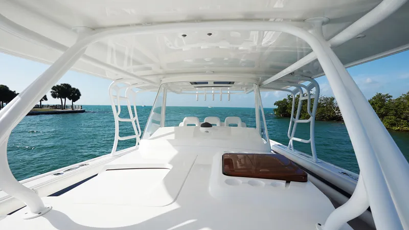Audacious Yacht Photos Pics 2016 Intrepid 475 Panacea boat on clear blue water, spacious deck view.