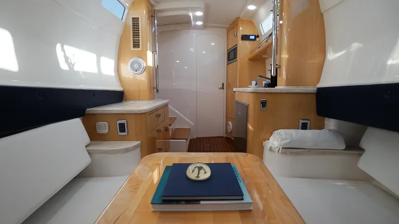 Audacious Yacht Photos Pics Interior of 2016 Intrepid 475 Panacea yacht with modern amenities and wooden finishes.