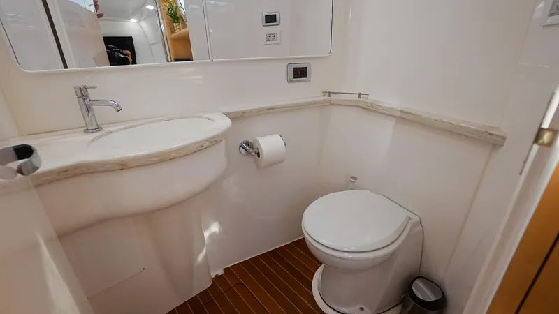 Audacious Yacht Photos Pics 2016 Intrepid 475 Panacea boat bathroom with sink and toilet.