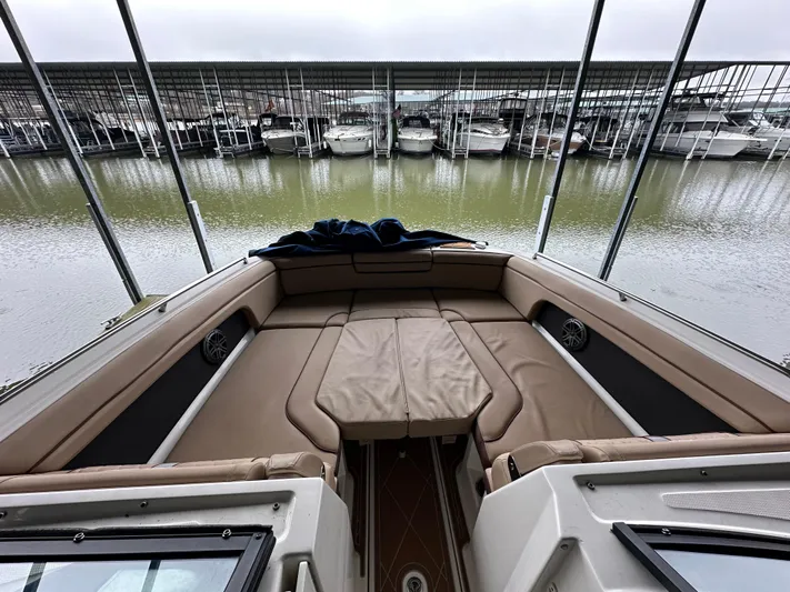  Yacht Photos Pics 2016 Sea Ray SDX 290 boat interior with spacious seating, docked at a marina.