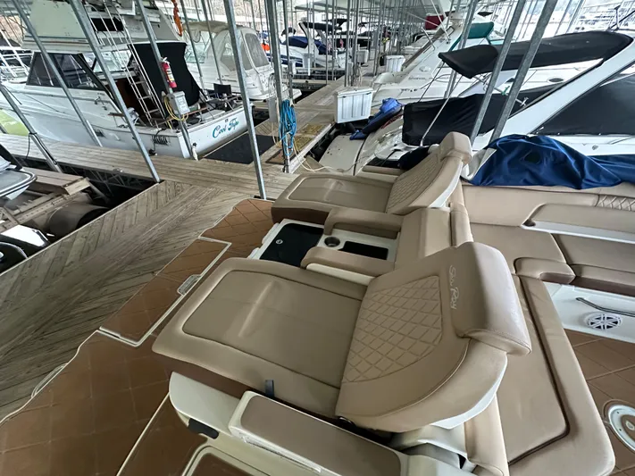  Yacht Photos Pics Luxurious seating on a 2016 Sea Ray SDX 290 boat in a marina.