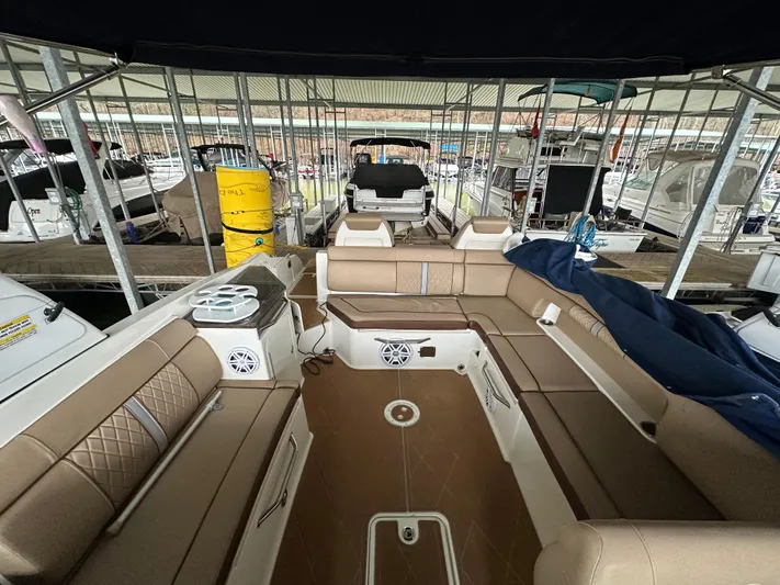  Yacht Photos Pics 2016 Sea Ray SDX 290 boat interior with tan seating, docked in a marina.