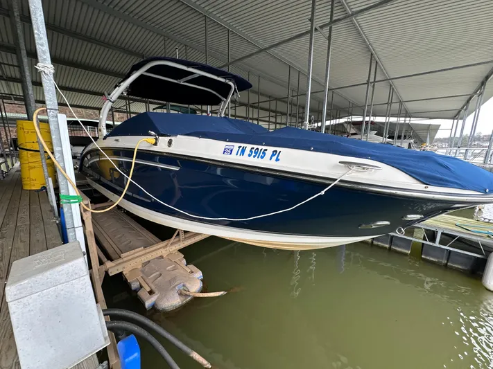  Yacht Photos Pics 2016 Sea Ray SDX 290 boat docked under a covered marina.