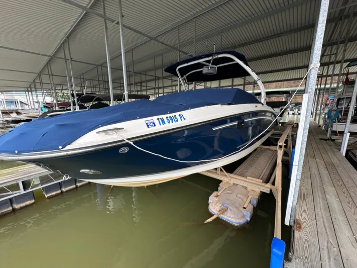  Yacht Photos Pics 2016 Sea Ray SDX 290 boat docked under a covered marina.