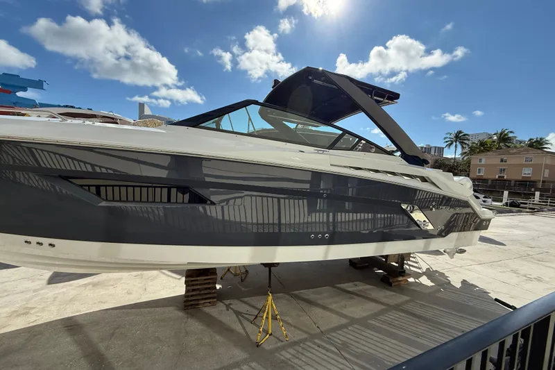  Yacht Photos Pics 2019 Cruisers Yachts 338 Outboard on dry dock under sunny skies.